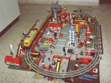 This is one of my favourite urban designs. It is based on the 7740 electric train set, which is fully elevated in this design, and equipped with two train stations.