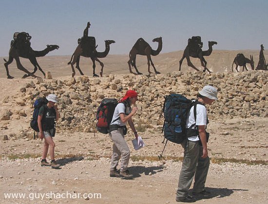 Trips_three_girls_walking_w_camels_9138.jpg